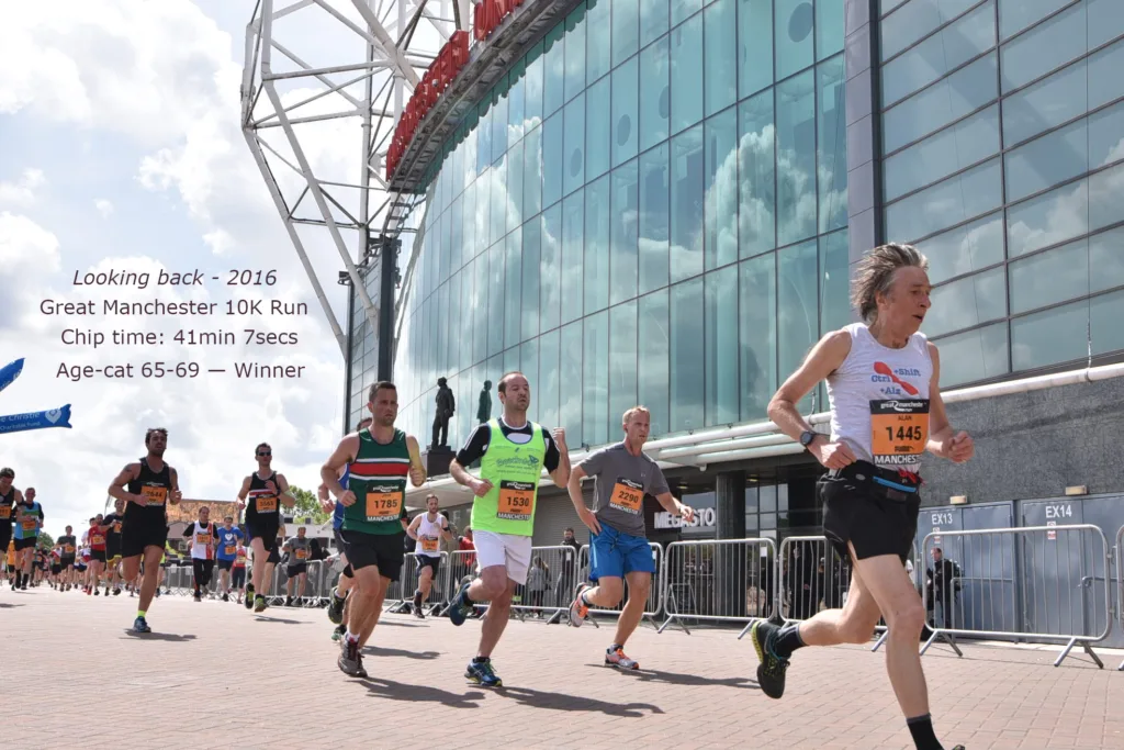 Alan passing Old Trafford in the Manchester 10K Run, 2016