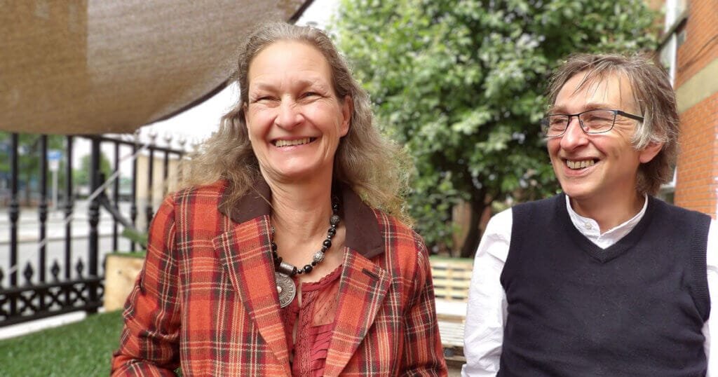 Lena and Alan pictured outside in a garden in 2015, with big smiles on their faces.